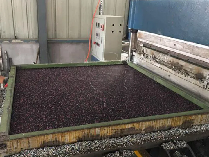 Black rubber crumb in machine mold
